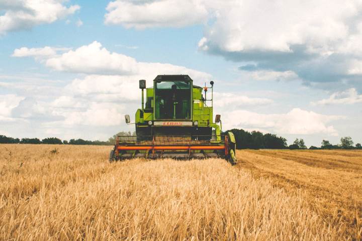 Image of combine harvester in field