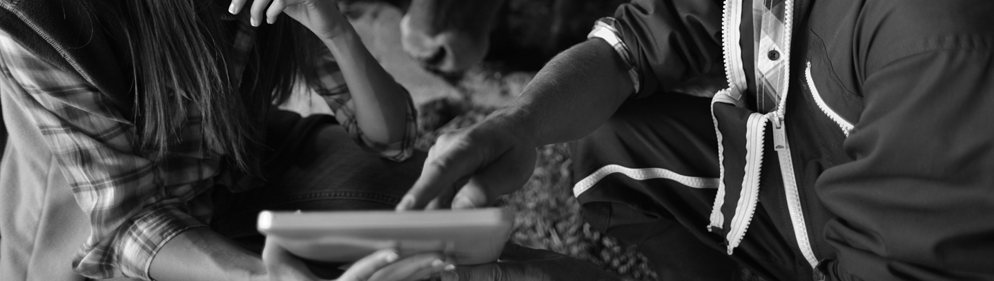 Image of couple using iPad on farm